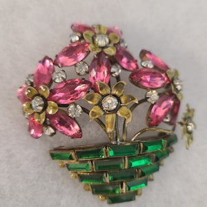 Signed Sandor Flowered rhinestone enameled brooch.