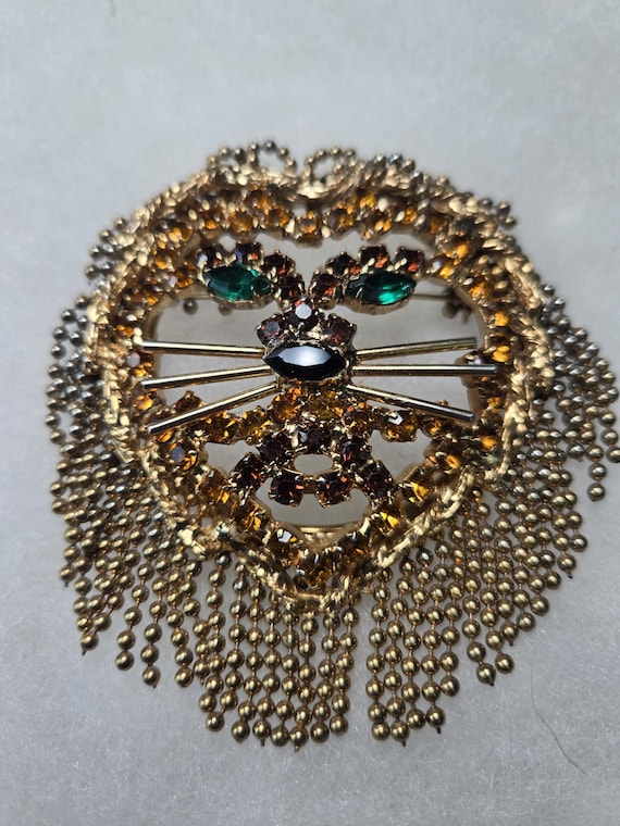 Unsigned Dominique lion head brooch.