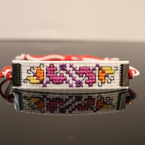 Bulgarian martenitsa with a pink embrodery