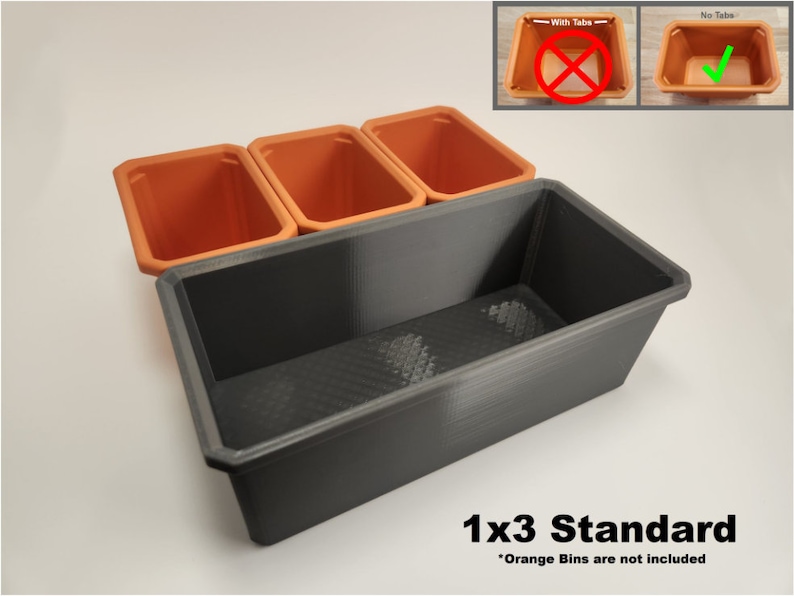 May include: A black plastic 1x3 standard planter with three orange plastic plant pots. The text "1x3 Standard" is printed below the planter. The text "Orange Bins are not included" is printed below the text "1x3 Standard".