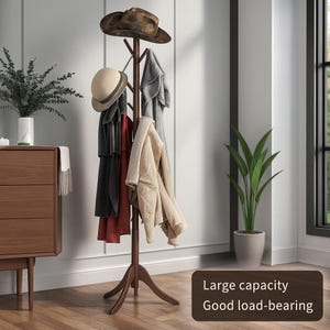 May include: A dark brown wooden coat rack with multiple branches for hanging items. Several coats and hats are displayed on the rack. The text on the image says "Large capacity Good load-bearing."