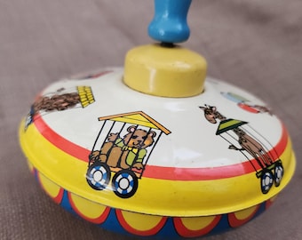 1950s Tin Litho Spinning Metal Top, circus design, blue handle, made in the USA by Ohio Art, Bryan, Ohio, good condition, spins beautifully