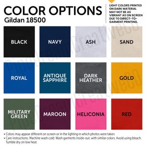May include: Color options for Gildan 18500 t-shirts.  The color swatches include black, navy, ash, sand, royal, antique sapphire, dark heather, gold, military green, maroon, heliconia, and red.