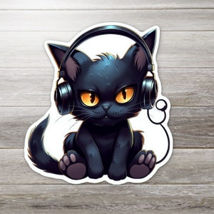 May include: A black cat with yellow eyes wearing headphones. The cat is sitting with its legs crossed and looking directly at the viewer.