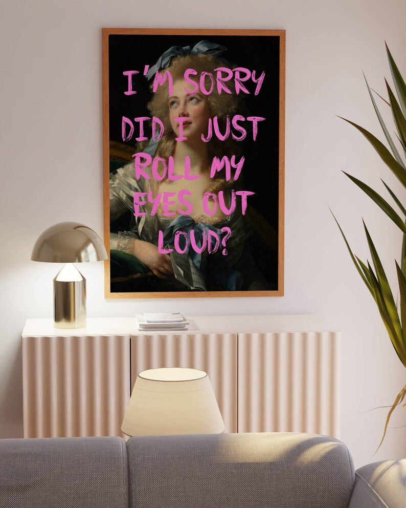 May include: A framed print of a painting of a woman with a blue ribbon in her hair. The text "I'M SORRY DID I JUST ROLL MY EYES OUT LOUD?" is written in pink over the image.