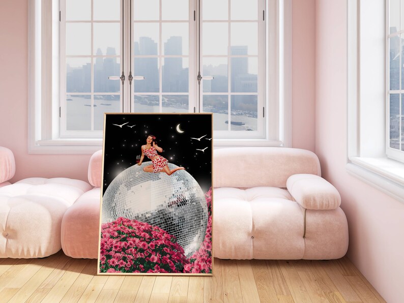 May include: A woman in a red and white polka dot dress sits on a large disco ball, surrounded by pink flowers. The background is a dark blue night sky with stars and a crescent moon.
