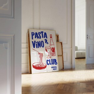 May include: A white poster with blue and red text that reads "Pasta Vino & Club Consumed Weekly". The poster features a hand-drawn illustration of a bowl of pasta, a glass of wine, and a bottle of wine.