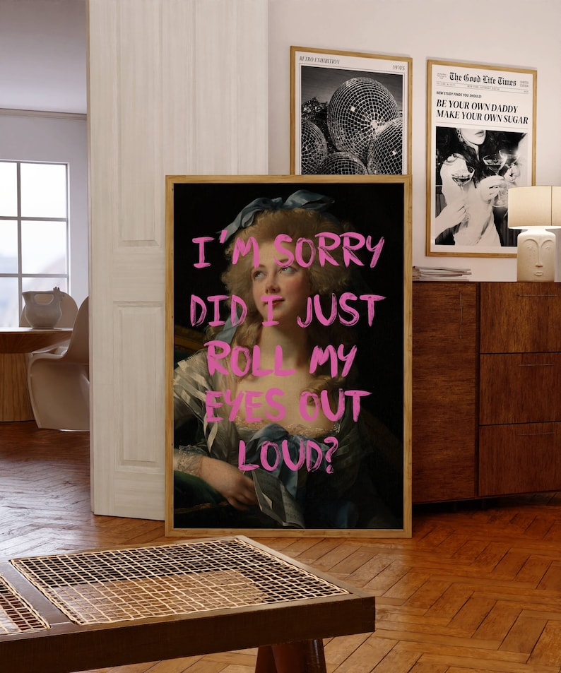 May include: A framed print of a painting of a woman with a blue ribbon in her hair. The woman is wearing a white dress and a blue shawl. The text "I'M SORRY DID I JUST ROLL MY EYES OUT LOUD?" is written in pink across the image.