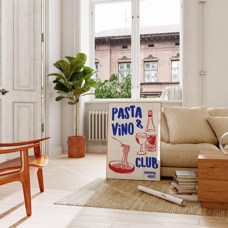 May include: A white poster with red and blue text that reads "PASTA VINO & CLUB CONCOCTED WEEKLY". The poster features a hand-drawn illustration of a bowl of pasta, a glass of wine, and a bottle of wine.