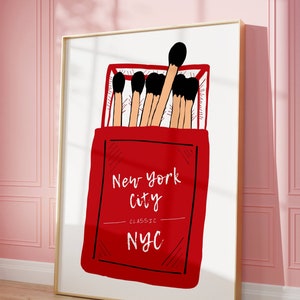 May include: A red matchbox with the text "New York City Classic NYC" and a drawing of matches inside.