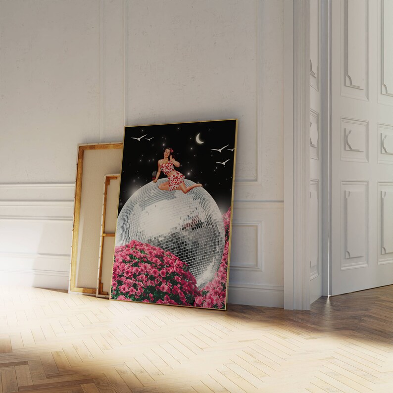 May include: A woman in a pink and white polka dot dress sits on a large disco ball surrounded by pink flowers. The background is a dark blue night sky with a crescent moon and white birds.
