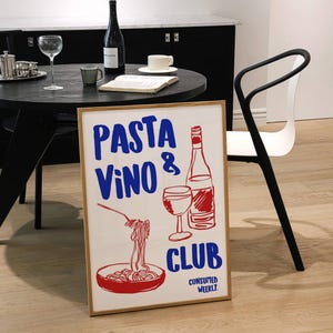 May include: A white poster with a red and blue illustration of a glass of wine, a bottle of wine, and a bowl of spaghetti. The poster says "PASTA VINO CLUB CONSUMED WEEKLY."