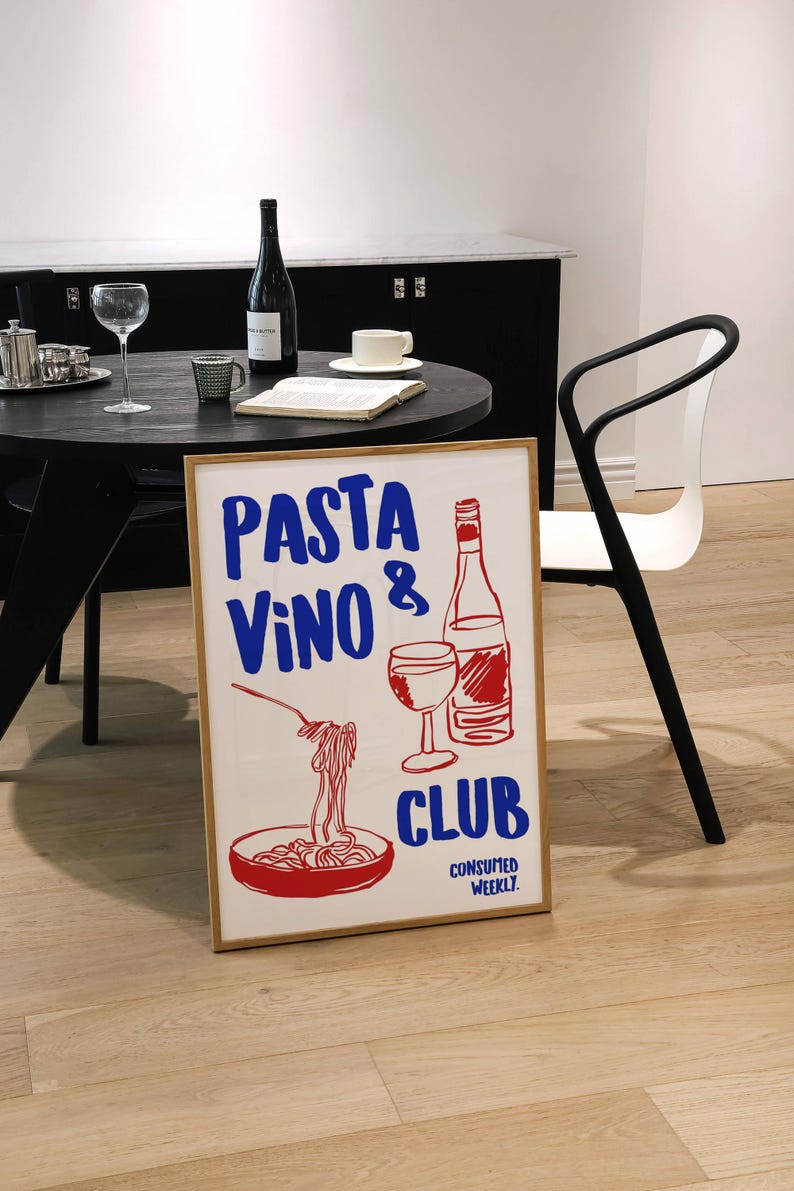 May include: A white poster with a red and blue illustration of a glass of wine, a bottle of wine, and a bowl of spaghetti. The poster says "PASTA VINO CLUB CONSUMED WEEKLY."