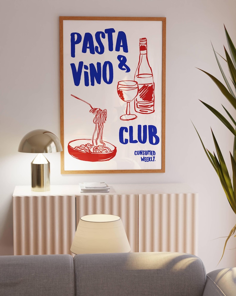 May include: A white poster with red and blue text that reads "PASTA VINO & CLUB CONSUMED WEEKLY". The poster features a hand-drawn illustration of a bowl of pasta, a glass of wine, and a bottle of wine.