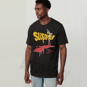 Vintage Suspiria 1977 horror movie t-shirt, retro 70s Italian horror movie suspiria movie poster graphic on oversized black unisex shirt