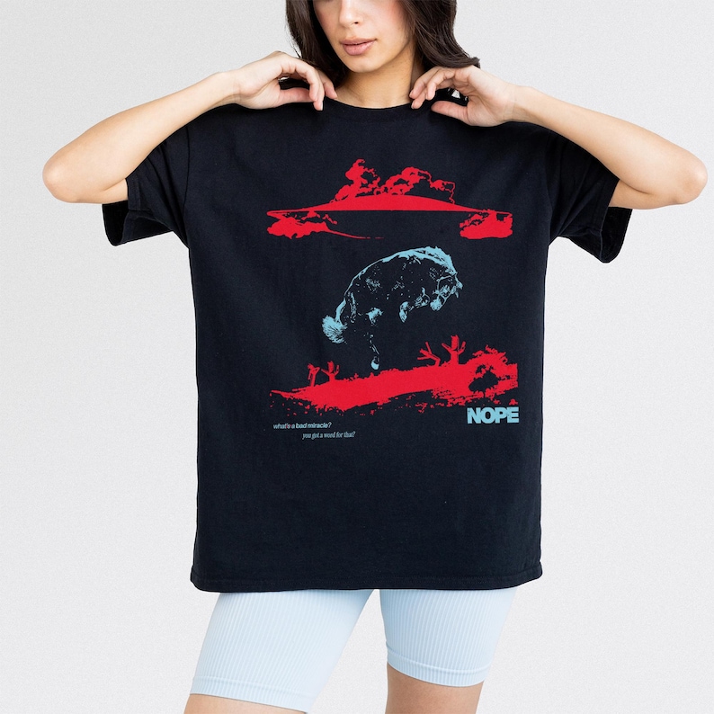 Jordan Peele Nope movie graphic tee, retro sci-fi horror movie t-shirt with UFO Aliens for Nope form Get Out director, unisex black horror movie shirt