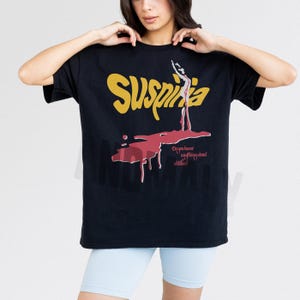 Vintage Suspiria 1977 horror movie t-shirt, retro 70s Italian horror movie suspiria movie poster graphic on oversized black unisex shirt