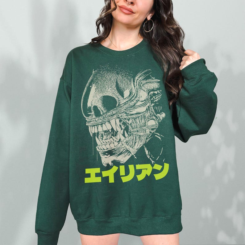 Retro original Alien movie sweatshirt, unisex sci-fi horror movie crewneck sweatshirt with Japanese movie poster text and streetwear style design on an oversized green sweater
