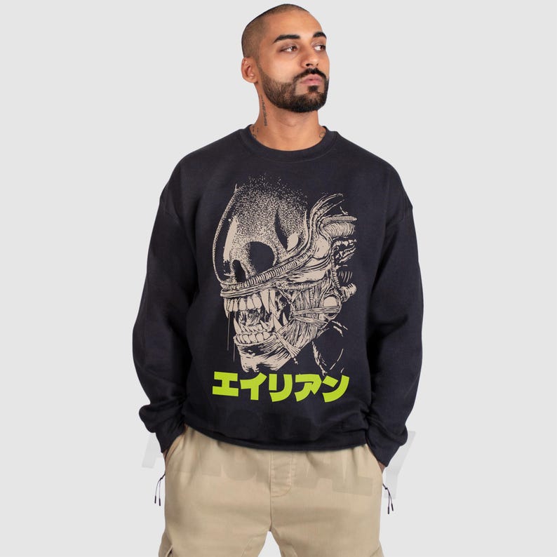 Retro original Alien movie sweatshirt, unisex sci-fi horror movie crewneck sweatshirt with Japanese movie poster text and streetwear style design on an oversized black sweater
