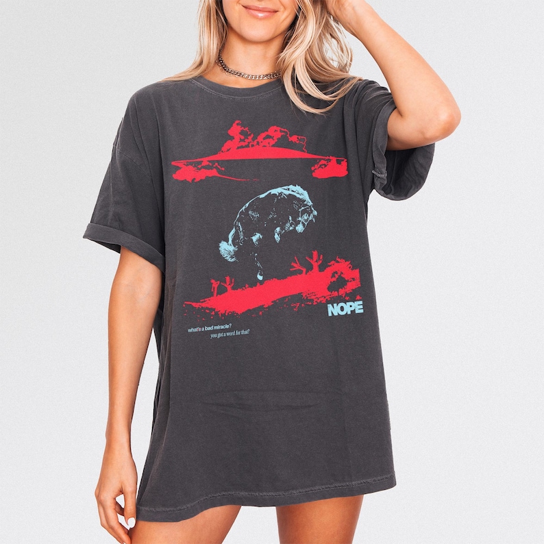 Jordan Peele Nope movie graphic tee, retro sci-fi horror movie t-shirt with UFO Aliens for Nope form Get Out director, modern faded washed black comfort colors horror movie shirt