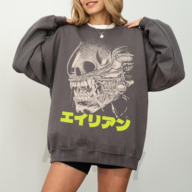 Retro original Alien movie sweatshirt, unisex sci-fi horror movie crewneck sweatshirt with Japanese movie poster text and streetwear style design on an oversized dark grey sweater