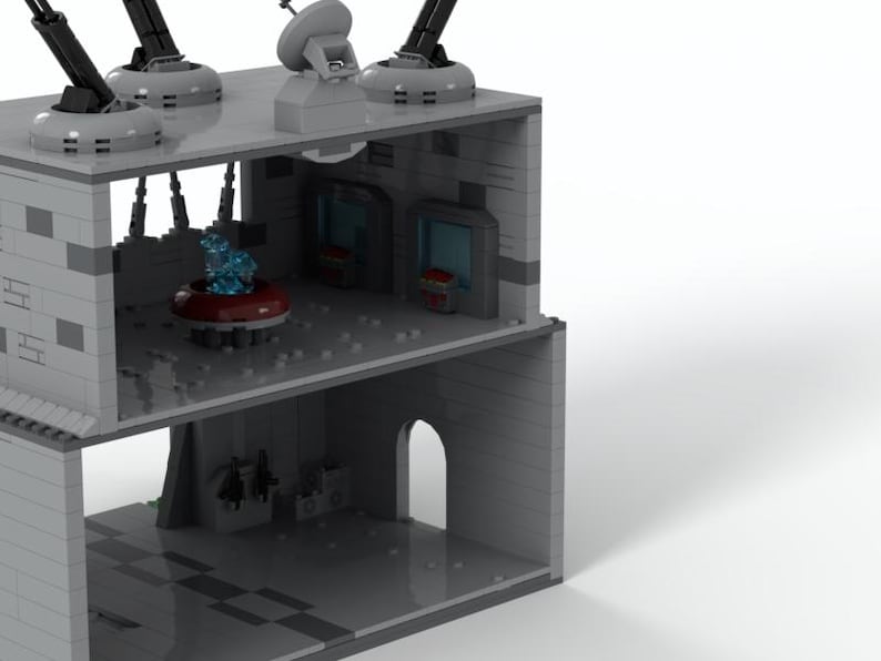K&ouml;nnte beinhalten: Ein graues Lego-Modell eines Geb&auml;udes mit einem blauen und roten Innenraum. Das Geb&auml;ude hat ein flaches Dach mit vier Kanonen und einer Radaranlage. Der Innenraum hat ein blaues und rotes Licht und eine rote Plattform.
