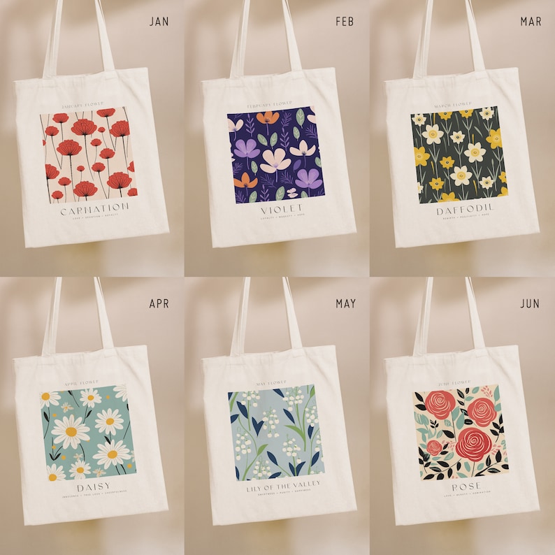 May include: Six white tote bags with floral patterns and the month and flower name printed on each bag. The flowers are carnation, violet, daffodil, daisy, lily of the valley, and rose.