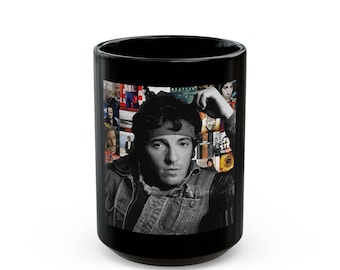 May include: Black ceramic coffee mug with a black and white photo of a man with a bandana on his forehead. The photo is surrounded by a collage of album covers.