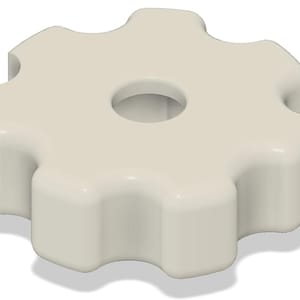 May include: A white plastic knob with a six-point star shape and a round hole in the center.