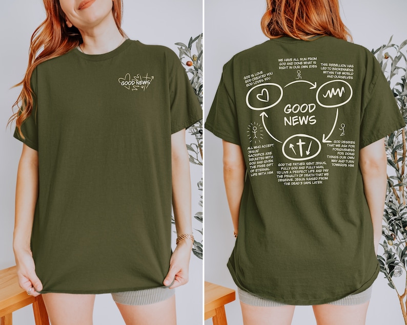 May include: A green t-shirt with a white graphic on the back. The graphic is a circle with arrows pointing in different directions. The text in the graphic says "GOOD NEWS" and includes a heart, a cross, and a wavy line. The text on the front of the shirt says "GOOD NEWS".