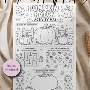 May include: A white paper activity mat featuring black line art for coloring. The text reads Pumpkin Patch Activity Mat, with sections for coloring pumpkins, a fox maze, counting autumn objects, and a space to design your own pumpkin.