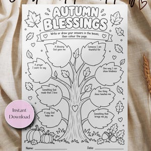 May include: A black and white printable activity sheet titled Autumn Blessings featuring a central tree with leaf-shaped prompts for writing or drawing. The page includes illustrations of pumpkins, acorns, and leaves, with spaces for a name and date at the bottom.