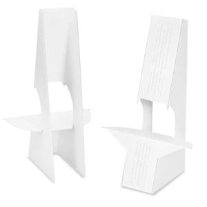 May include: Two white cardboard display stands. Each stand has a rectangular back with a curved top and a horizontal shelf. The stands are designed to hold items for display. The stands are made of white cardboard.