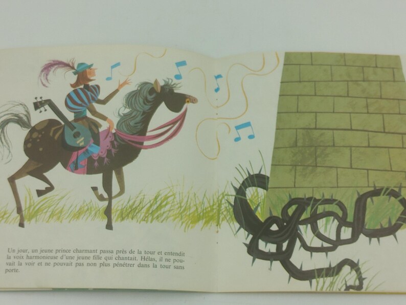 May include: Illustration from a children's book depicting a prince playing a lute on horseback. The prince wears a blue hat and striped clothing. Musical notes float in the air. A brick tower and thorny vines are also visible.
