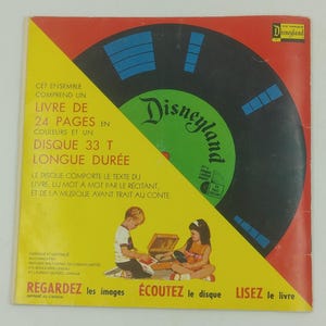 May include: Vintage Disneyland record album cover. The cover features a black record with a green label and the Disneyland logo. The cover is yellow and red with French text and illustrations of children. The text reads "Regardez les images, &Eacute;coutez le disque, Lisez le livre."