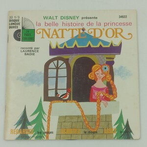 May include: Vintage Walt Disney record album cover featuring the title "la belle histoire de la princesse NATTE D'OR". The cover art depicts a princess with long blonde braids, a tower, and a bird. The album is a 33 1/3 RPM long-playing record.