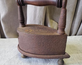 Antique Cast Iron Sad Iron with Wooden Handle and Trivet