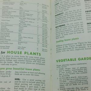 May include: Open book pages with botanical information, including plant names, colors, and blooming times. The text includes instructions on caring for house plants and vegetable gardening, with details on temperature, soil, and watering.