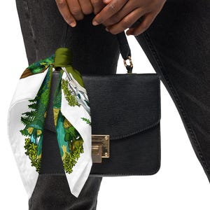 This is a photo of the bandana scarf tied to a black purse.