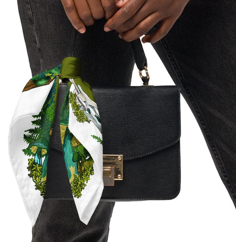 This is a photo of the bandana scarf tied to a black purse.