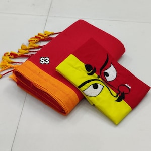 May include: Red and yellow saree with a black and white embroidered design. The saree has an orange border and a yellow blouse with a black and white embroidered design. The saree is labelled "S3".