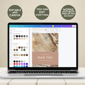 May include: A laptop screen displaying a Canva design template for an ebook cover. The template features a beige background with a subtle marble pattern and a text box that says "BY YOUR NAME Book Title". The text box is a light brown color with a pink outline. The template is editable with Canva.