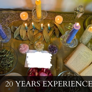 a table with candles, books, and other items on it