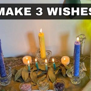 a table topped with candles and a book