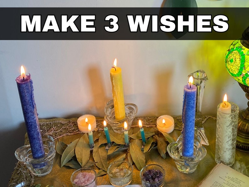 a table topped with candles and a book