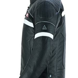 May include: Black leather motorcycle jacket with white and red accents. The jacket has a  Kenpfit logo on the left sleeve.