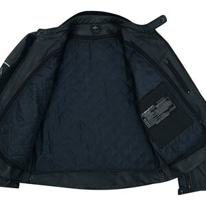 May include: Black leather jacket with a quilted lining and a zippered pocket on the left side. The jacket has a label that reads "JACKSONVILLE" inside the pocket.