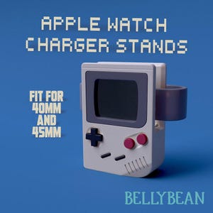 May include: White and gray Apple Watch charger stand shaped like a retro video game console. The stand is designed to fit both 40mm and 45mm Apple Watches. The text "APPLE WATCH CHARGER STANDS" and "FIT FOR 40MM AND 45MM" is displayed on the image. The text "BELLYBEAN" is displayed at the bottom of the image.