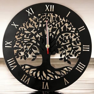 May include: Black clock with a tree of life design. The clock face has Roman numerals and a red hour hand and a gold minute hand.