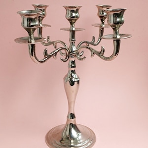 Silver plated table candlestick for 5 candles.